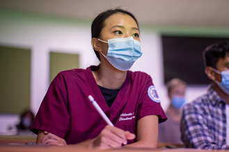 a nurse in a lecture hall