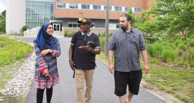 students walking through mays landing campus