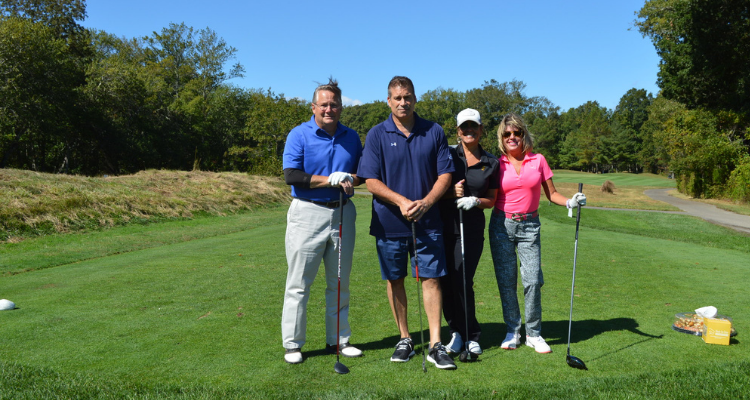 Golfers stand on the Cape May National golf course