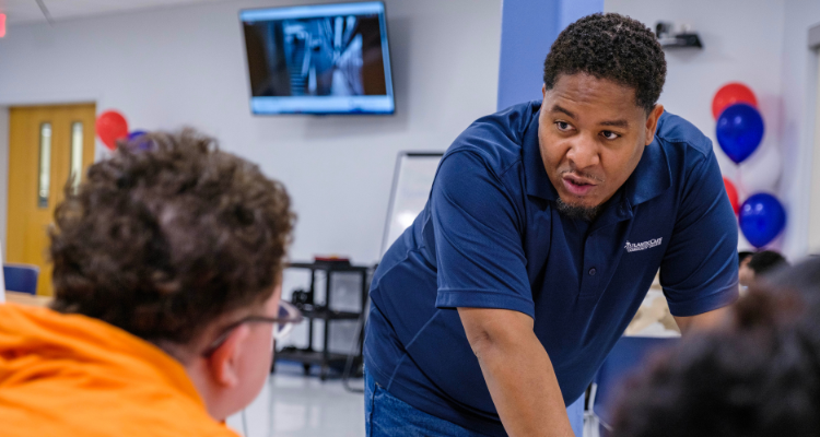 Director of Student Support Services Rashawn Martin speaks to a student