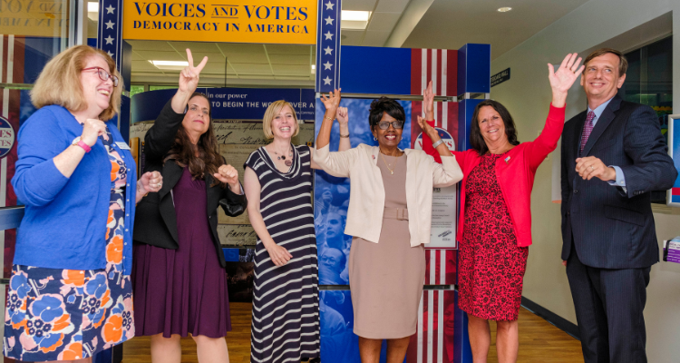 From left, Ellen Byrne, vice president of the Atlantic Cape Community College Board of Trustees; Dr. Denise Coulter, dean of Professional and Liberal Studies; New Jersey Council for the Humanities Executive Director Carin Berkowitz; Atlantic Cape President Dr. Barbara Gaba; Atlantic County Board of Commissioners Chairwoman Maureen Kern; and New Jersey Council of County Colleges President Aaron Fichtner celebrate after cutting the ribbon on the “Voices and Votes: Democracy in America” exhibition at Atlantic Cape Community College’s Mays Landing campus during a reception July 7, 2022.