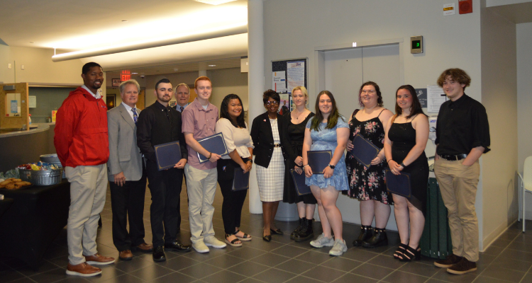 Members of the Atlantic Cape Archery team with Dr. Barbara Gaba, college president, at the Board of Trustees meeting May 24, 2022 at the Cape May County campus. .