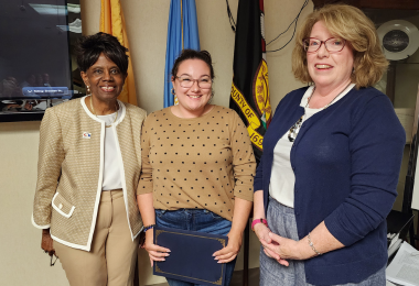 Trustee Julia Train between Dr. Barbara Gaba and Trustee Ellen Byrne