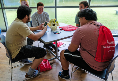 New students sitting around a table at new student orientation day in Cape May