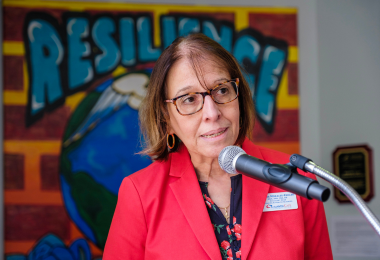 Atlantic Cape Dean of Nursing and Health Services Myrna Morales-Keklak speaks to those in attendance at the Resilience painting unveiling