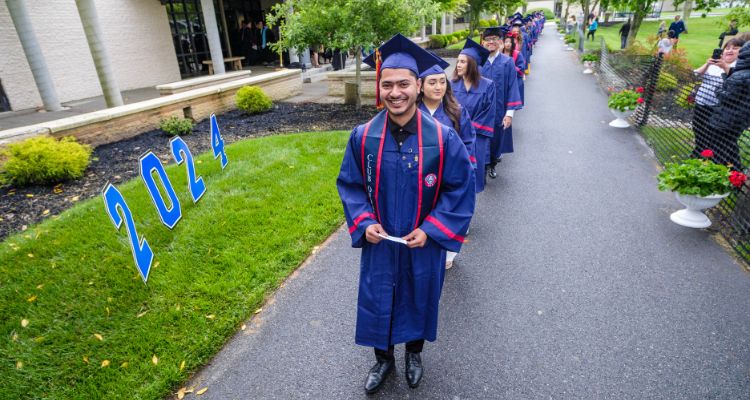 The Class of 2024 enters the Quad for Commencement