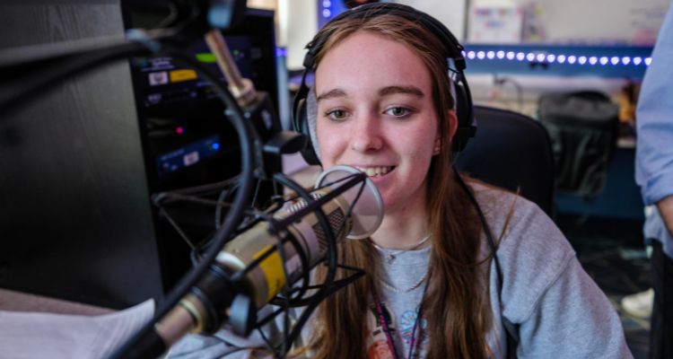 Student tries her hand at announcing a song on the radio